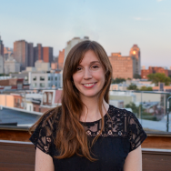 woman in a black shirt smiling