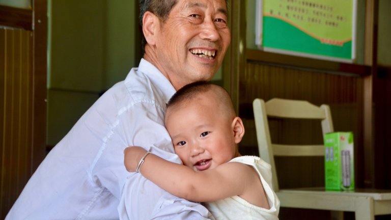 grandad and baby hug