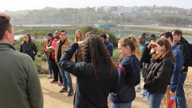 Group of people standing on a hill