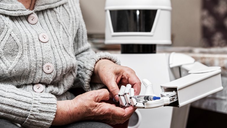 Autonomous caregiver robot is holding a insulin syringe, giving it to an senior adult woman, concept ambient assisted living