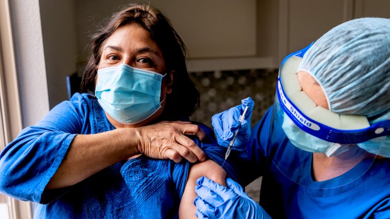 Woman gets vaccinated.