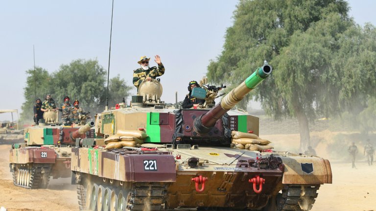 Indian Prime Minister Narendra Modi rides in a tank at Longewala in Jaisalmer, Rajasthan, 14 November 2020.