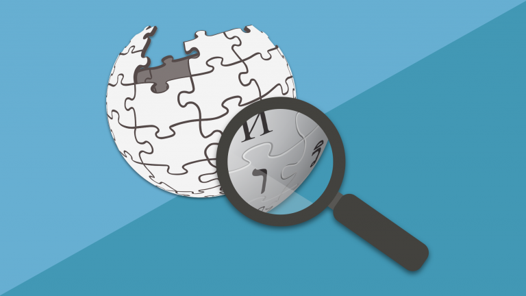 magnifying glass hovering over Wikipedia logo