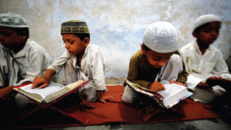 Muslim children read the Quran at an Indian madrassa. india muslim children tehelka