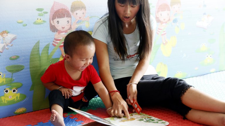 mom and baby reading