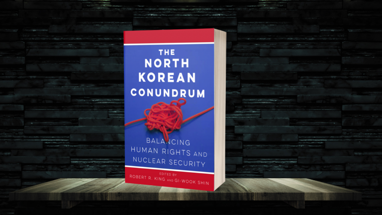 The book 'The North Korean Conundrum' with a bookshelf background