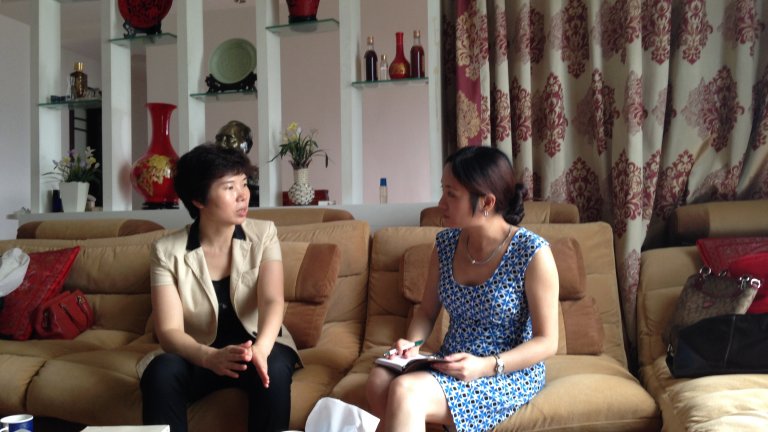 Ling Chen (at Right), a postdoctoral fellow at Shorenstein APARC, interviews a Chinese bureaucrat. picture 4