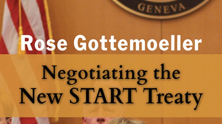 Image of Rose Gottemoeller sitting in front of the U.S. flag