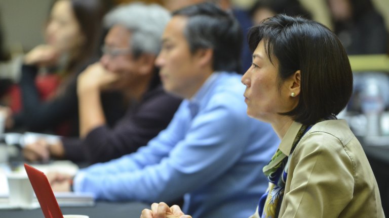 Conference participants listening intently