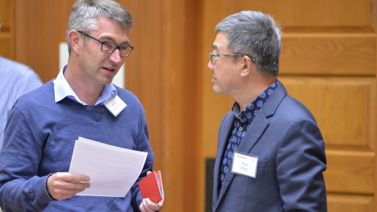 Scholars in conversation during an AHPP workshop at Stanford