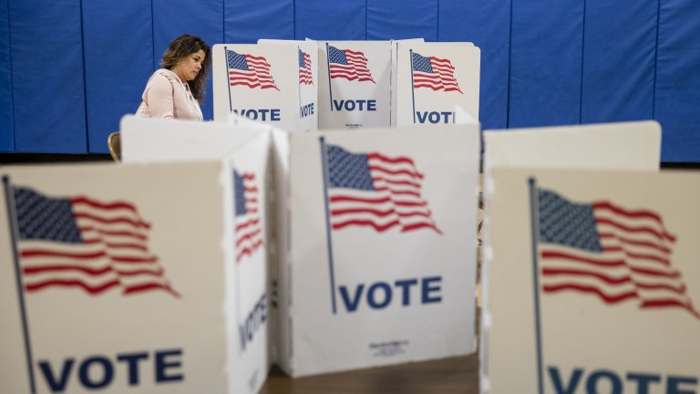Woman at a voting machine