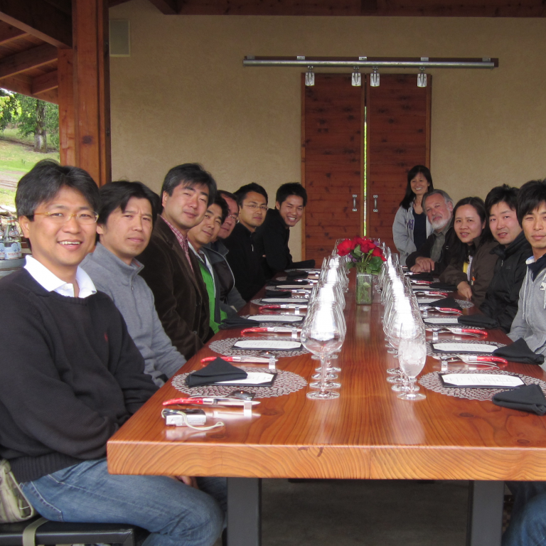 2010-11 cohort of Global Affiliate visiting fellows seated around a table at a Bay Area winery.