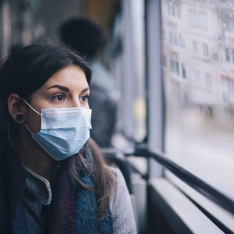 Worried woman in face mask.