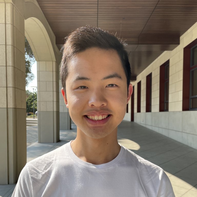 A headshot of Jason Chao. Jason is smiling and standing.