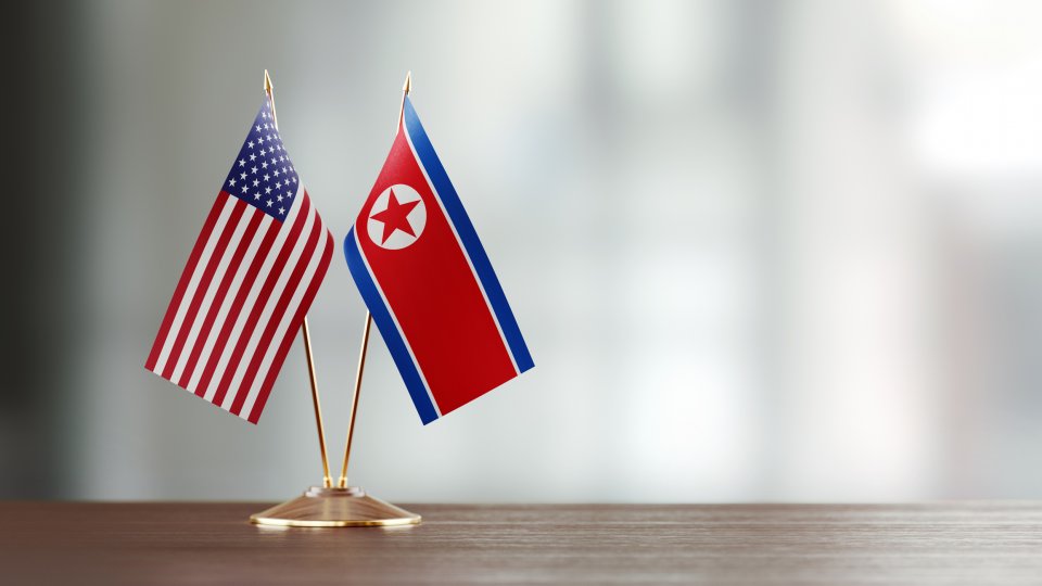 U.S. and DPRK Flags on Table