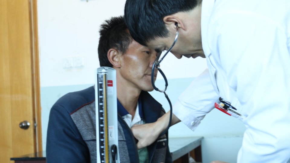 doctor examining man
