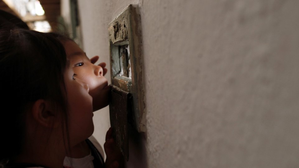 Children look around cells at Seodaemun Prison, the former prison used to lock Independent fighters from 1908, on August 15, 2016 in Seoul, South Korea.