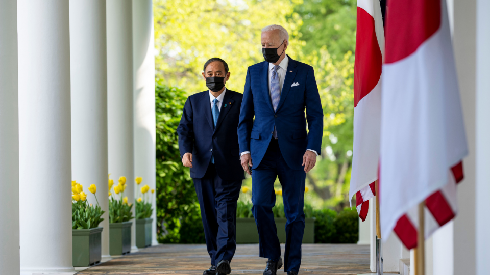 President Biden and President Suga walk through the Rose Garden colonnade at the White House