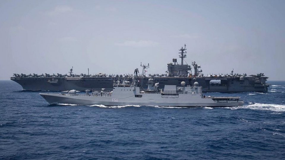 The Indian Navy Talwar-class frigate INS Tarkash (F50) transits alongside the aircraft carrier USS Theodore Roosevelt (CVN 71) during a passing exercise with the Theodore Roosevelt Carrier Strike Group, Indian Ocean, March 2018