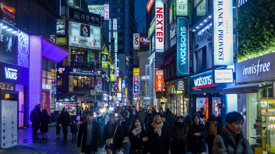 People walking at night in Myeongdong district of Seoul, South Korea