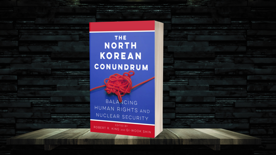 The book 'The North Korean Conundrum' with a bookshelf background
