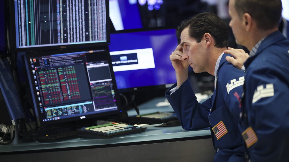 Traders and financial professionals work ahead of the closing bell on the floor of the New York Stock Exchange (NYSE) on August 1, 2019 in New York City.