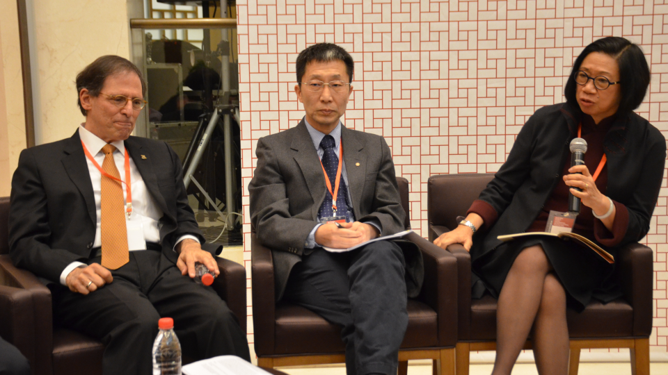 China Program Director Jean Oi in conversation with two panelists.