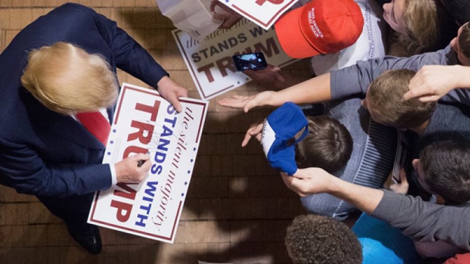 Trump signs campaign poster Trump signs campaign poster