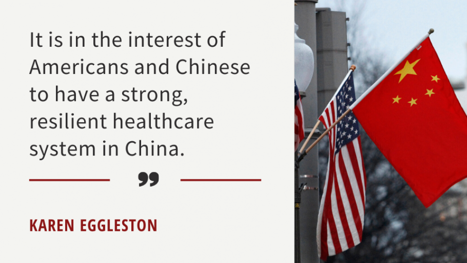 U.S. and China flags hanging from a lamp post in Capitol Hill