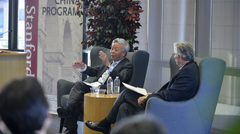 AIIB President Jin Liqun in conversation with Thomas Fingar in front of an audience