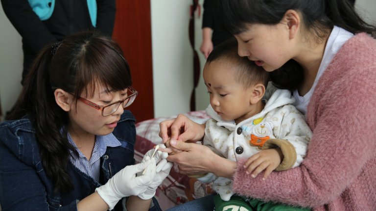 doctor baby blood sample