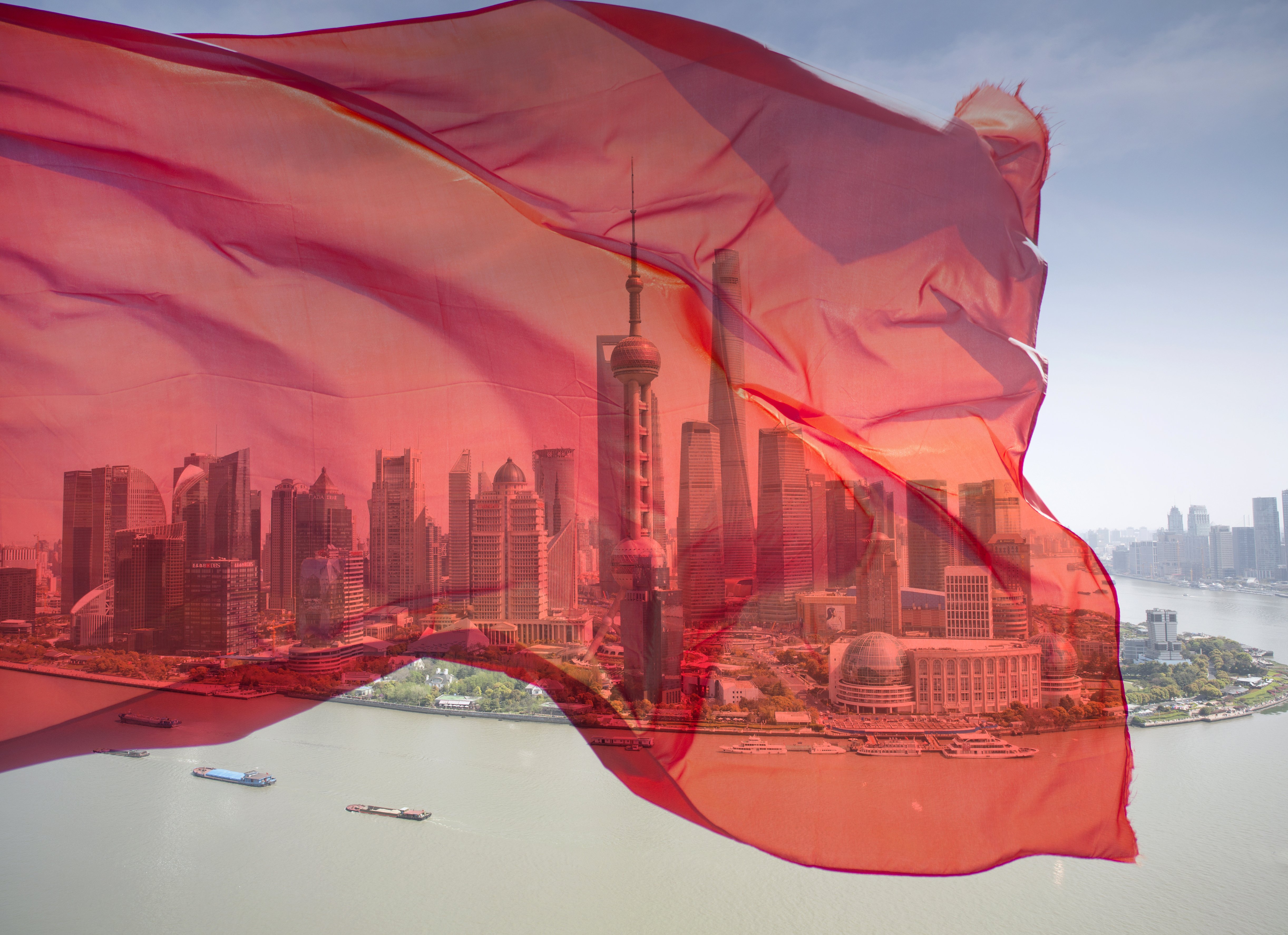 Image of red flag over the Shanghai Bund