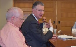 Ambassador Dan Kritenbrink and Donald Emmerson seated at a conference room during a group discussion