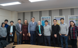 A group of people posing to the camera
