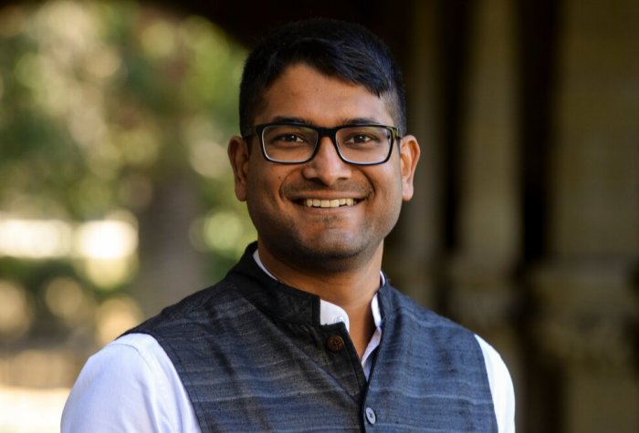 man with glasses smiling