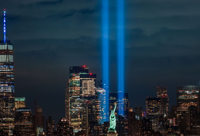 Pillars of light are projected from the 9/11 Memorial Site where the Twin Towers used to stand in New York CIty.