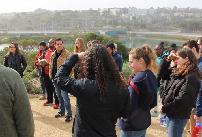 Group of people standing on a hill
