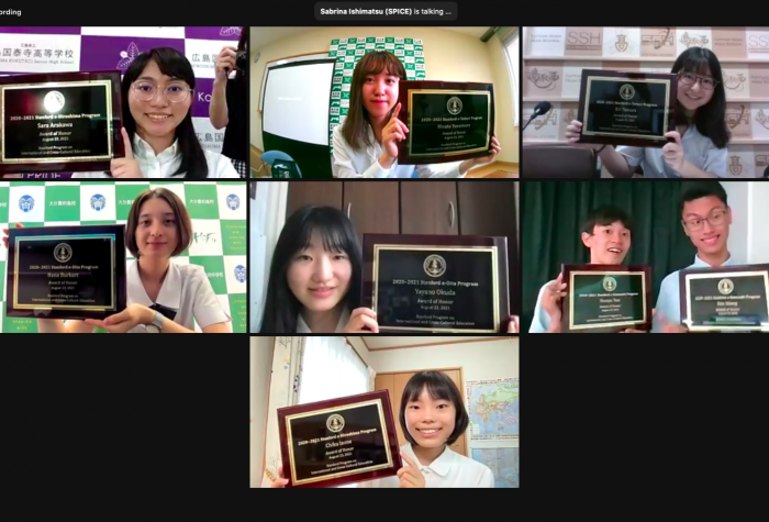 Photo of student honorees holding plaques