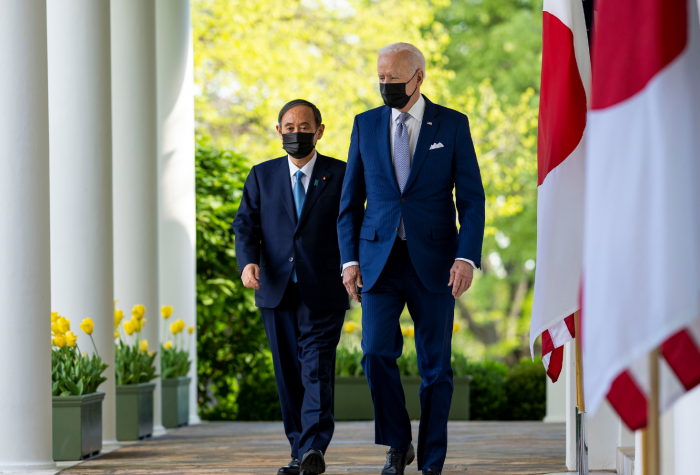 President Biden and President Suga walk through the Rose Garden colonnade at the White House