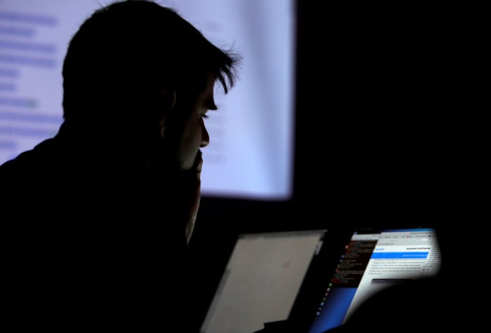 man looking at computer