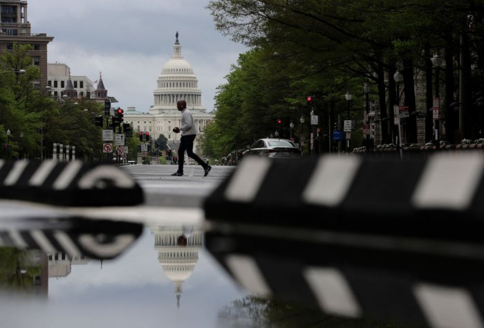 An empty Pennsylvania Avenue in Washington, D.C. seen with the United States Capitol in the background.