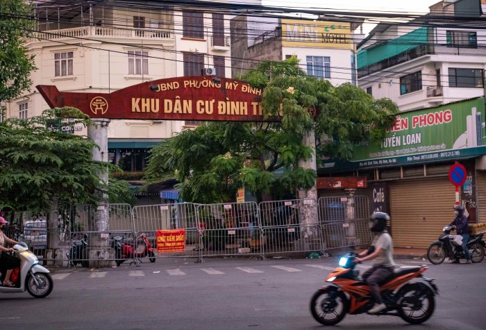 A makeshift barricade is seen in front of a residential area to restrict movement and control COVID-19 spread in Hanoi, Vietnam.