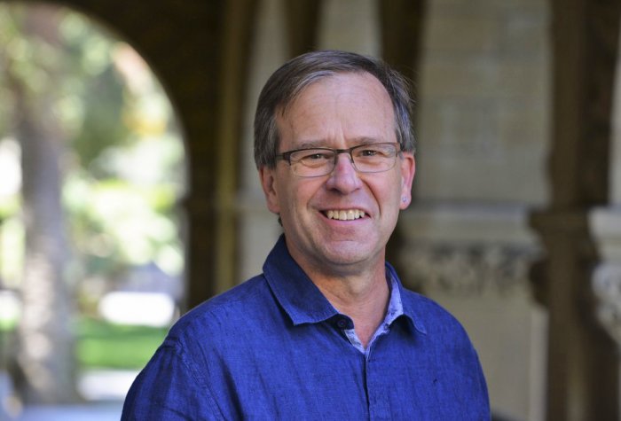man with glasses smiling
