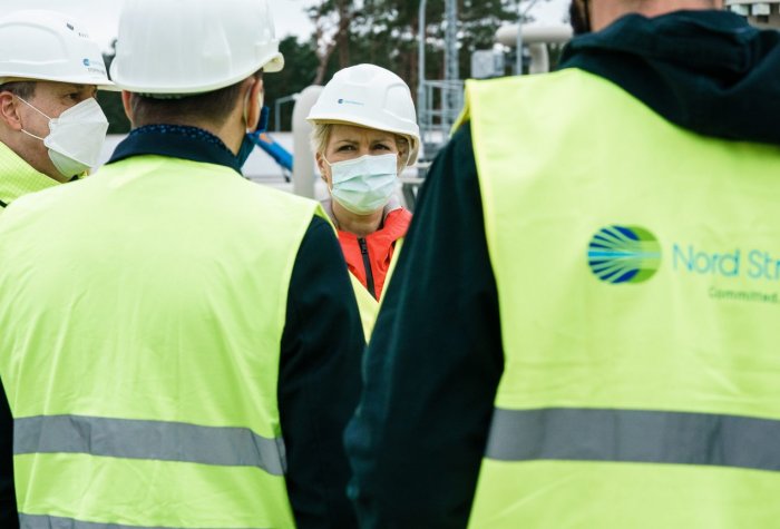 Manuela Schwesig (C), State Premier of Mecklenburg-Western Pomerania, talks with representatives of the Nord Stream 2 pipeline during a visit to the industrial port and the landfall facility of the joint German-Russian pipeline project in Lubmin, Germany,