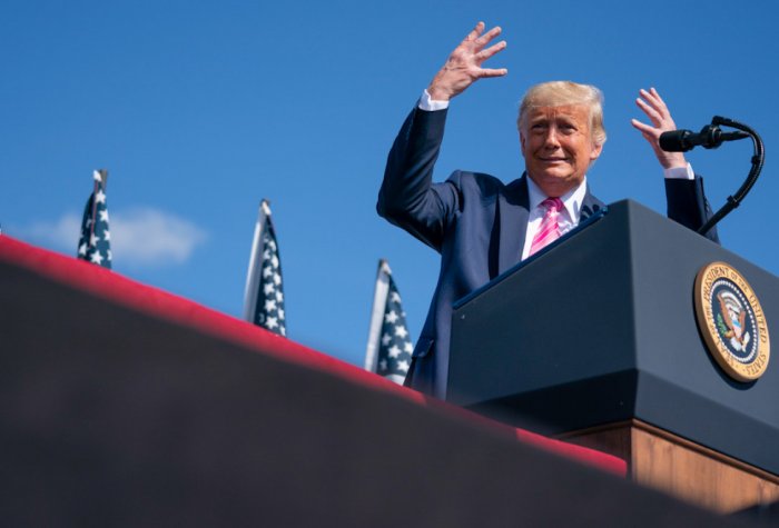 President Trump speaking in front of a podium