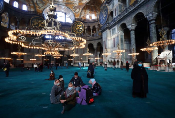 Russian tourists visit Ayasofya-i Kebir Camii or Hagia Sophia Grand Mosque, Istanbul, Turkey, January 29, 2021