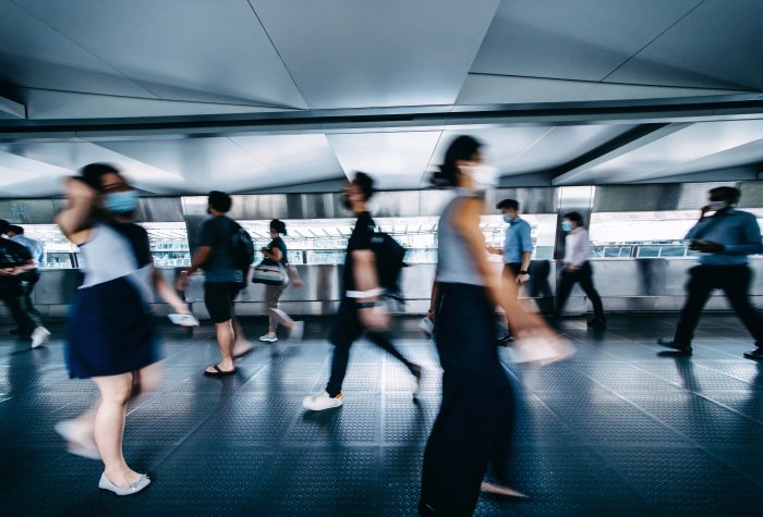 Commuters wear protective masks