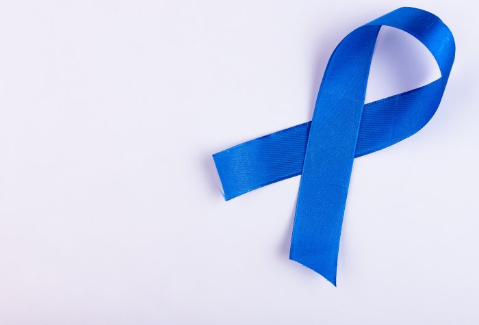 A blue ribbon represents colon cancer awareness.