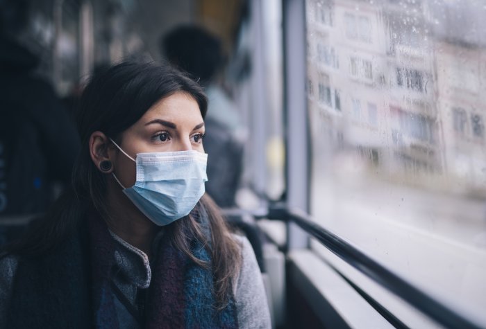 Worried woman in face mask.