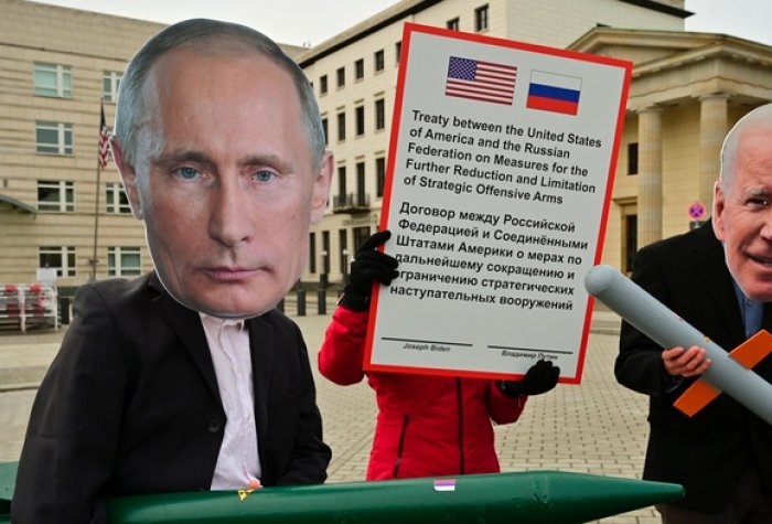 Peace activists wearing masks of Russian President Vladimir Putin and U.S. President Joe Biden pose with mock nuclear missiles in front of the U.S. embassy in Berlin on Jan. 29, 2021.
